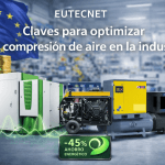 Imagen destacada de EUTECNET con varios compresores de aire comprimido industriales, elementos de ahorro energético y entorno de fábrica para artículo sobre aire comprimido industrial